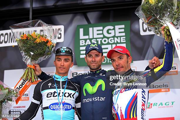 Race winner Alejandro Valverde of Spain and Movistar Team celebrates his victory with second placed Julian Alaphilippe of France and Etixx - Quick...