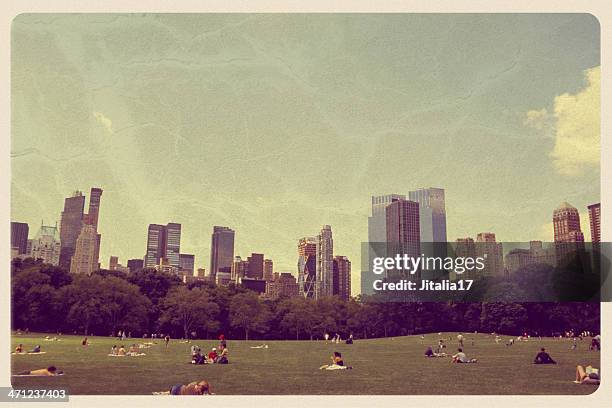 grande prato a central park-vintage postcard - cartolina postale foto e immagini stock