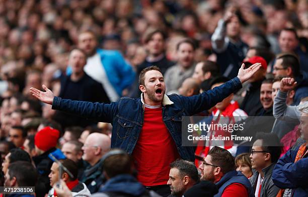 Arsenal fans chant during the Barclays Premier League match between Arsenal and Chelsea at Emirates Stadium on April 26, 2015 in London, England.