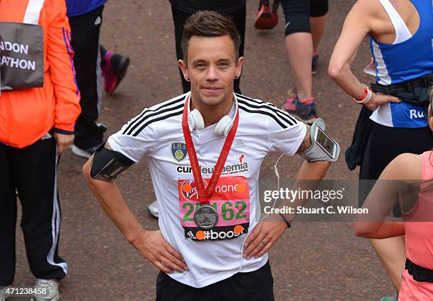 Lee Hendrie poses at the finish line during The London Marathon 2015 on April 26, 2015 in London, England.