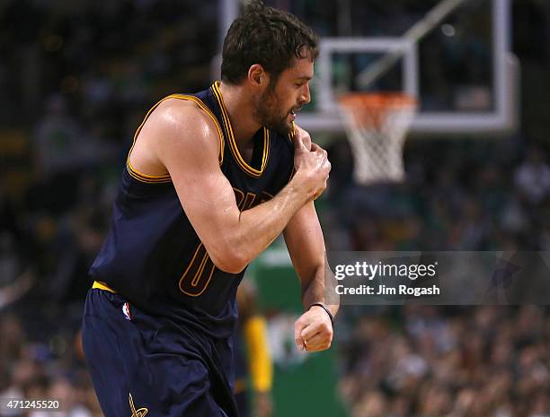 Kevin Love of the Cleveland Cavaliers leaves the court after an injury against the Cleveland Cavaliers in the first quarter in Game Four during the...