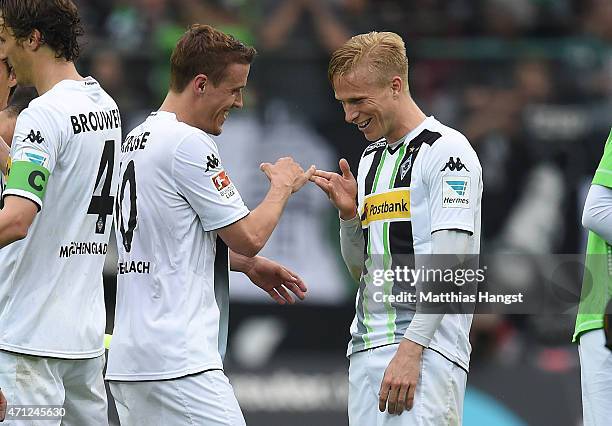 Max Kruse of Gladbach and Oscar Wendt of Gladbach celebrate after the Bundesliga match between Borussia Moenchengladbach and VfL Wolfsburg at...