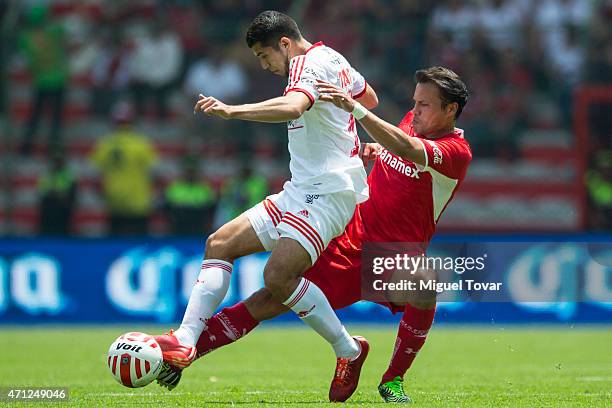 Aaron Galindo of Toluca fights for the ball with Joe Corona of Tijuana during a match between Toluca and Tijuana as part of 15th round Clausura 2015...