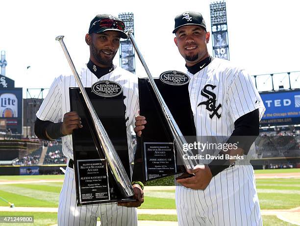 Alexei Ramirez of the Chicago White Sox and Jose Abreu hold the silver slugger award before the game against the Kansas City Royals on April 26, 2015...