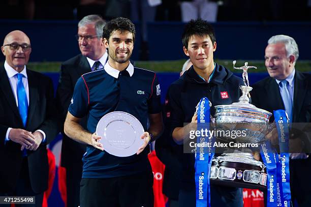 Kei Nishikori of Japan poses with the Barcelona Open Banc Sabadell trophy after defeating Pablo Andujar of Spain on their final match during day...