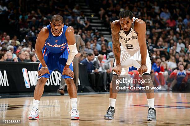 Chris Paul of the Los Angeles Clippers stands on the court during a game against Kawhi Leonard of the San Antonio Spurs during Game Four of the...