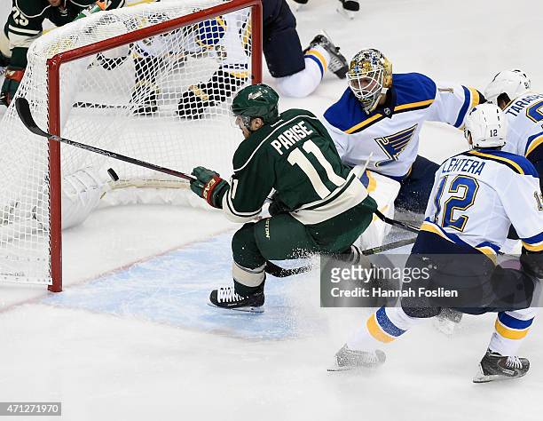 Zach Parise of the Minnesota Wild scores a goal against Brian Elliott of the St. Louis Blues during the third period in Game Six of the Western...