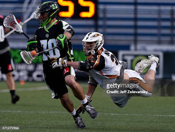 John Ranagan of Rochester Rattlers chases Steve DeNapoli of New York Lizards in the second half at James M. Shuart Stadium on April 26, 2015 in...