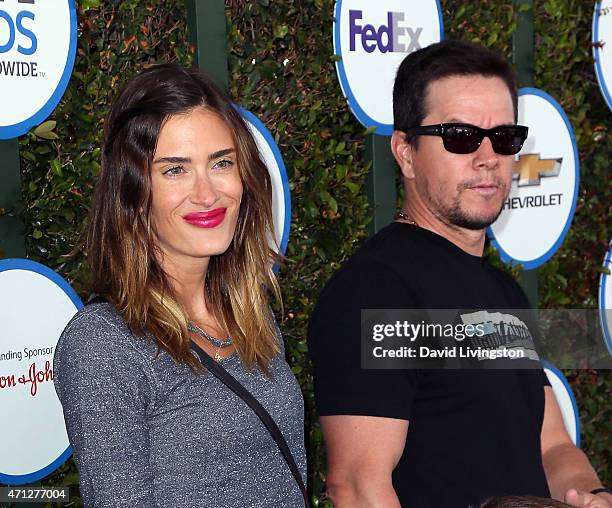 Model Rhea Durham and husband actor Mark Wahlberg attend Safe Kids Day presented by Nationwide at The Lot on April 26, 2015 in West Hollywood,...