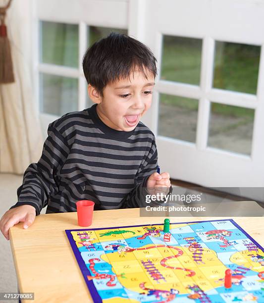 winning the game - snakes and ladders stock pictures, royalty-free photos & images