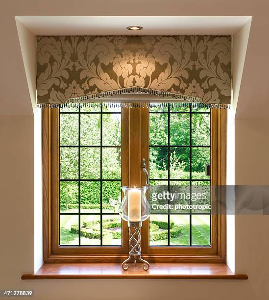 leaded glass window and candle - wood ledge stock pictures, royalty-free photos & images
