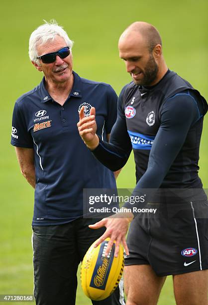 Mick Malthouse the coach of the Blues talks to Chris Judd during a Carlton Blues AFL media session at Ikon Park on April 27, 2015 in Melbourne,...