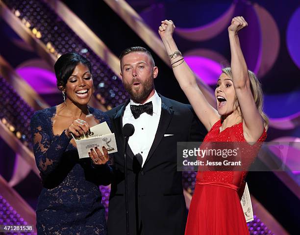 Actors Karla Mosley, Jacob Young, and Linsey Godfrey onstage during The 42nd Annual Daytime Emmy Awards at Warner Bros. Studios on April 26, 2015 in...