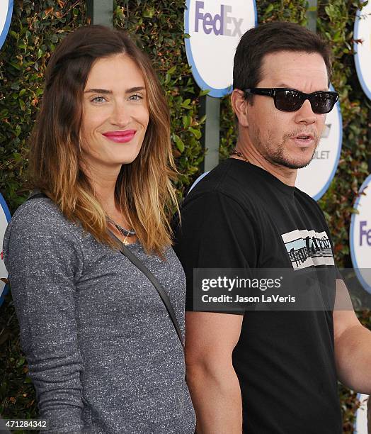 Rhea Durham and Mark Wahlberg attend Safe Kids Day at The Lot on April 26, 2015 in West Hollywood, California.