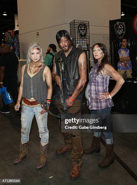 Macy Rose of California, dressed as the character Beth Greene, Ben Layton of Utah, dressed as the character Daryl Dixon, and Tara Layton of Utah,...