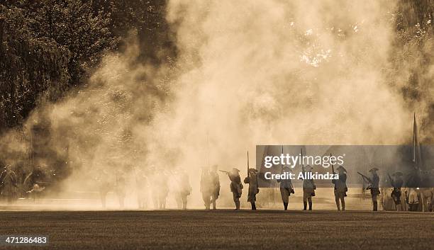 silouettes in cannon smoke ii - boston common stock pictures, royalty-free photos & images