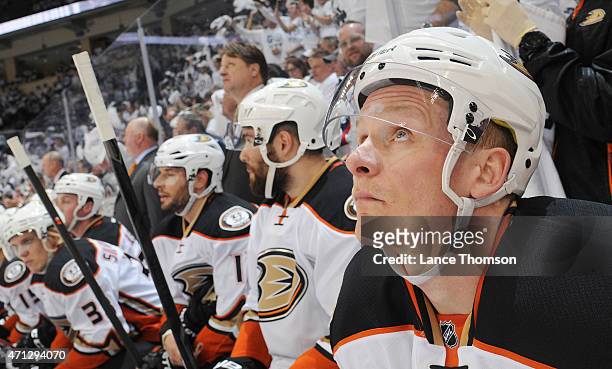 Corey Perry of the Anaheim Ducks looks on from the bench during first-period action against the Winnipeg Jets in Game Three of the Western Conference...