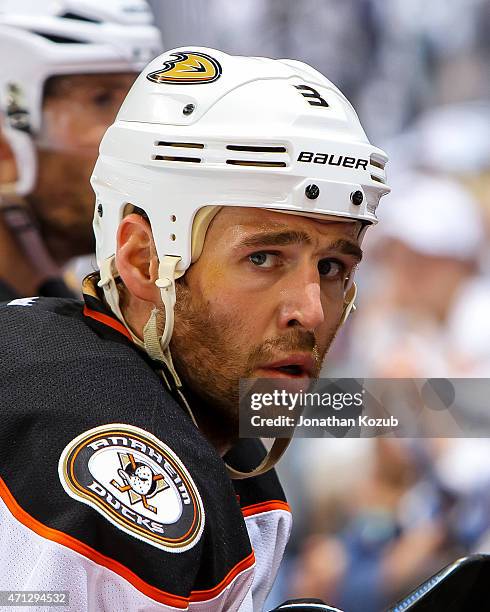 Clayton Stoner of the Anaheim Ducks looks on from the bench during third-period action against the Winnipeg Jets in Game Three of the Western...