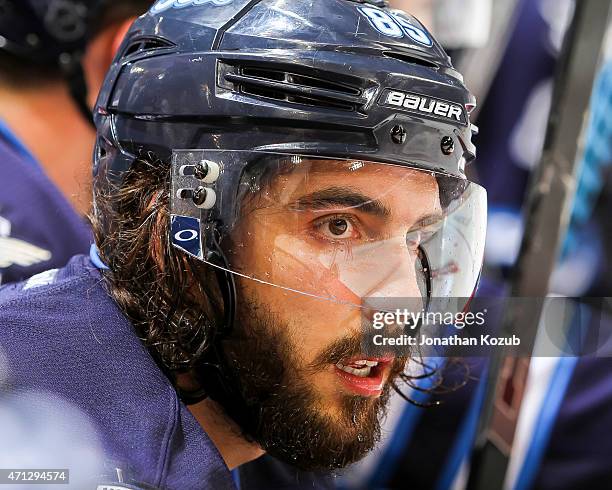 Mathieu Perreault of the Winnipeg Jets looks on from the bench during third-period action against the Anaheim Ducks in Game Three of the Western...