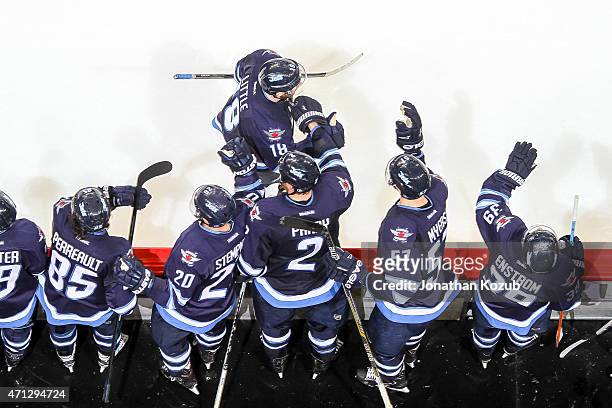 Bryan Little of the Winnipeg Jets celebrates his second-period goal against the Anaheim Ducks with teammates at the bench in Game Three of the...