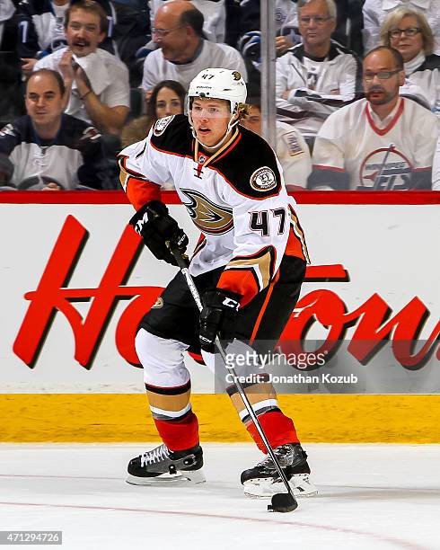 Hampus Lindholm of the Anaheim Ducks plays the puck during overtime against the Winnipeg Jets in Game Three of the Western Conference Quarterfinals...