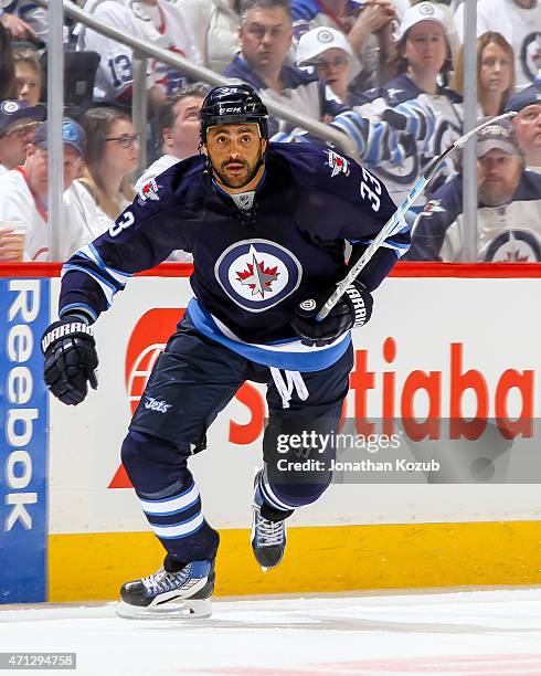 Dustin Byfuglien of the Winnipeg Jets follows the play down the ice during first-period action against the Anaheim Ducks in Game Three of the Western...