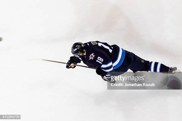 Bryan Little of the Winnipeg Jets shoots the puck down the ice during second-period action against the Anaheim Ducks in Game Three of the Western...