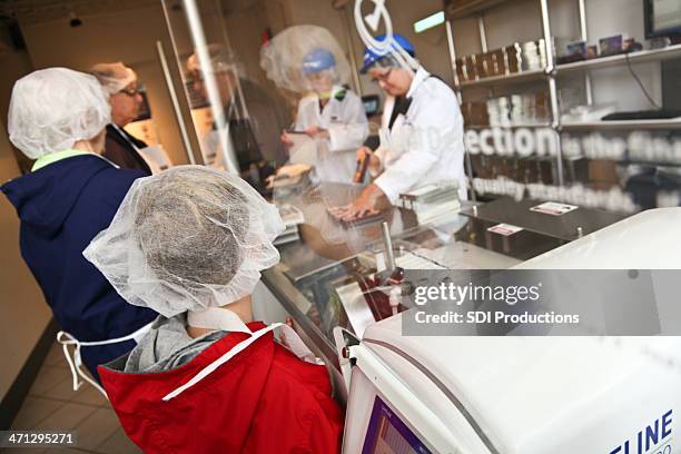 customers waiting for chocolate bar at hershey factory in pennsylvania - hershey stock pictures, royalty-free photos & images