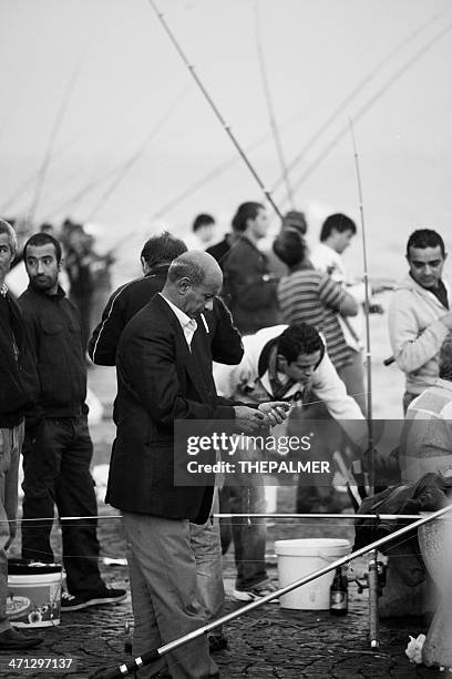 elegant fisherman in istanbul - blazer jacket stockfoto's en -beelden