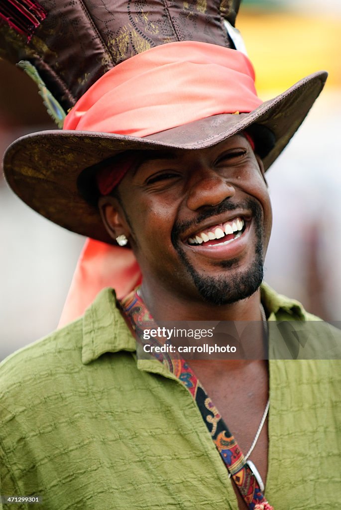 Smiling African American Man Wearing Giant Hat High-Res Stock Photo - Getty  Images