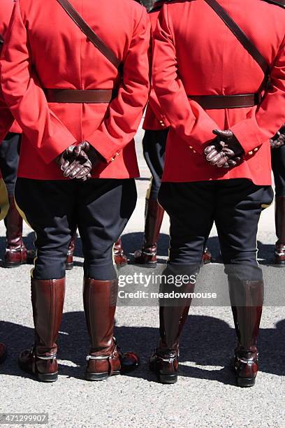 two rcmp stand at-ease at fellow officer's funeral - lethbridge alberta stock pictures, royalty-free photos & images