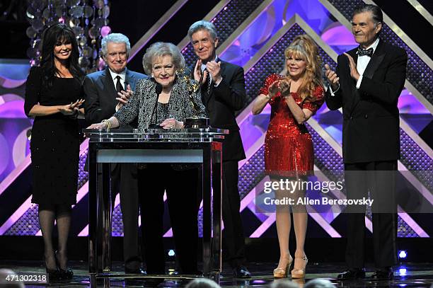 Singer Marie Osmond, tv personality Regis Philbin, actress Betty White, tv personality Tom Bergeron, actors Charo and Fred Willard speak onstage...