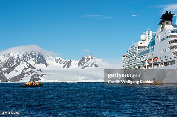 Cruise ship Seabourn Quest with passengers in zodiac in the Antarctic Sound at Hope Bay in the Antarctic Peninsula region.