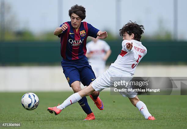 Pablo Moreno Taboada of Barcelona is challenged by Max Cavallo of Stuttgart during the Final of the Santander Cup for U13 teams between FC Barcelona...