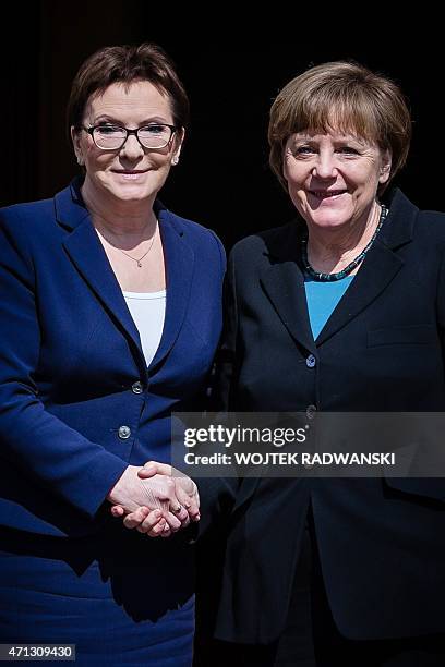 Polish Prime Minister Ewa Kopacz and German Chancellor Angela Merkel pose for a photo during welcoming ceremony at the beginning of Polish-German...