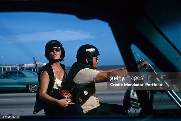 Couple from the Bandidos gang on a motorbike. Texas , September 1969.