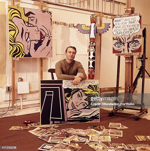 The American painter and representative of Pop Art, Roy Lichtenstein, poses confidently among some of his works. 1964.