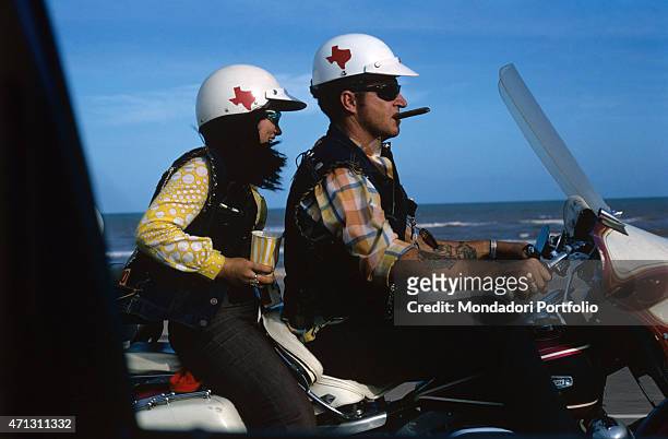 Couple of the Bandidos gang on a motorbike on a coastal road. Texas , September 1969.