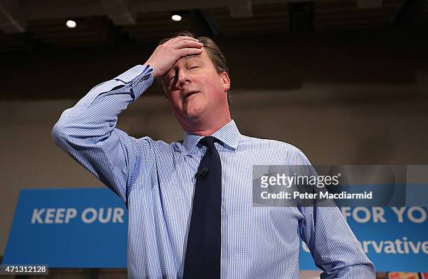 Prime Minister David Cameron wipes away some sweat as he speaks to business leaders on April 27, 2015 in London, England. Mr Cameron has started the...