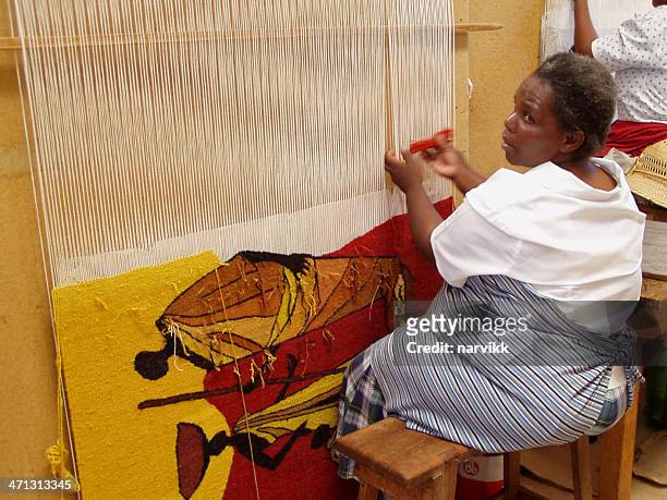 woman weaving hand made rug in lesotho - lesotho stock pictures, royalty-free photos & images
