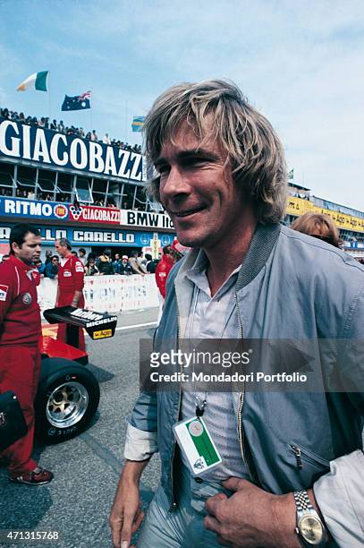 British car racing driver James Hunt smiling on a race-track. 1970s