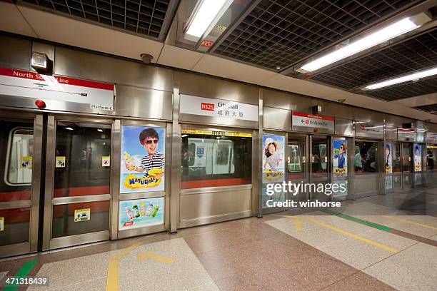 city hall mrt station - singapore mrt stock pictures, royalty-free photos & images