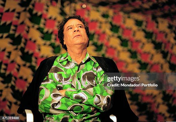 The politician Muammar Gaddafi posing in a tent for a photo shooting during the interview given to Stella Pende. Amsa'd, October 2000