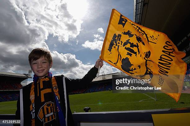 Young Hull City fan waves his Dean Windass flag during the Barclays Premier League match between Crystal Palace and Hull City at Selhurst Park on...