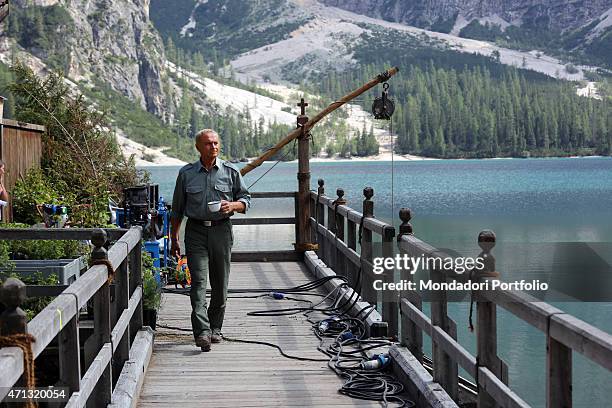 Italian actor Terence Hill as the State Forestry Corps Chief inspector Pietro walking on the pier with a mug in the hand in a photo shooting on the...