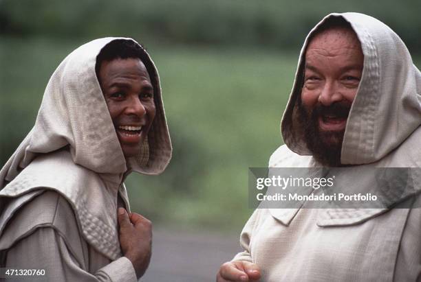 American actor Philip Michael Thomas and Italian actor Bud Spencer dressed as two missionary friars smiling on the set of the TV series We Are...