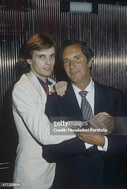 Spanish torero Luis Miguel Dominguin holding by the hand his son and Spanish-born Italian singer Miguel Bos. Spain, 1980