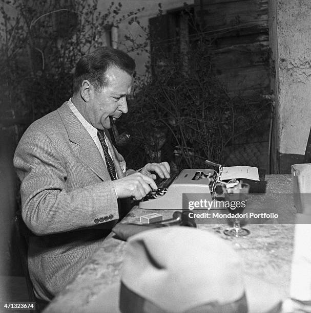 Belgian writer Georges Simenon typewriting. Milan, 1957