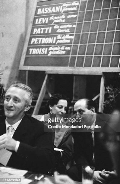Italian actor and entrepreneur Guido Alberti attending the 10th Strega Prize with Italian writer and translator Maria Bellonci. On the board behind...