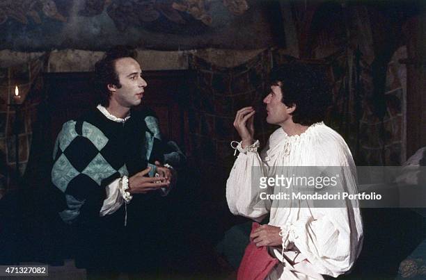 Italian actor and director Massimo Troisi gesticulating beside Italian actor and director Roberto Benigni in the film Non ci resta che piangere. 1984